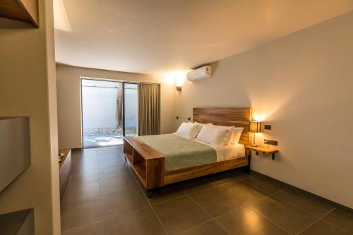 a bedroom with a bed with a view of the ocean at Casa Olié in Oaxaca City