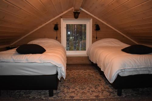 Säng eller sängar i ett rum på Norbel Hytte Norway