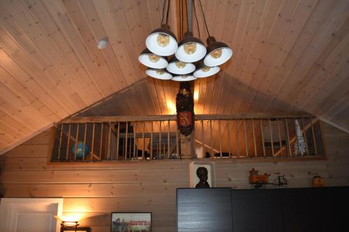 a chandelier hanging from a ceiling in a room at Norbel Hytte Norway in Vradal