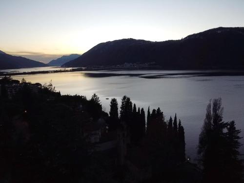 a view of a large body of water at sunset at Anna's Home in Campione dʼItalia