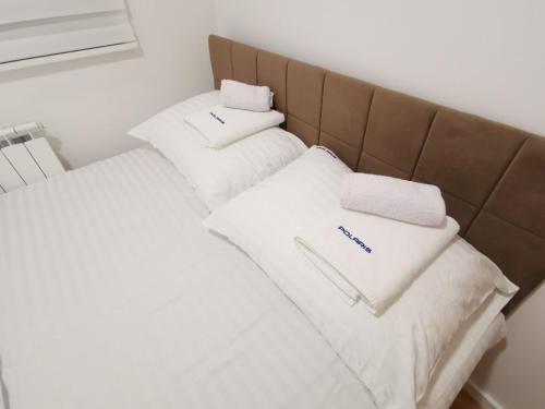 Postel nebo postele na pokoji v ubytování APARTMANI POLARIS JAHORINA