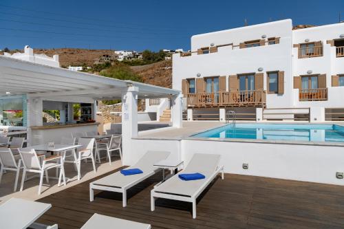 a villa with a swimming pool and a patio at Lithos by Spyros & Flora in Agios Ioannis Mykonos