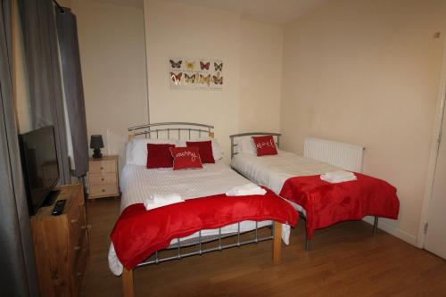 A bed or beds in a room at West Lea House