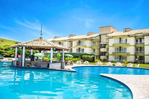 a swimming pool with a gazebo in front of a hotel at ALDEIA DAS ÁGUAS PARK RESORT in Barra do Piraí