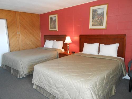 Postel nebo postele na pokoji v ubytování Aquarius Motel