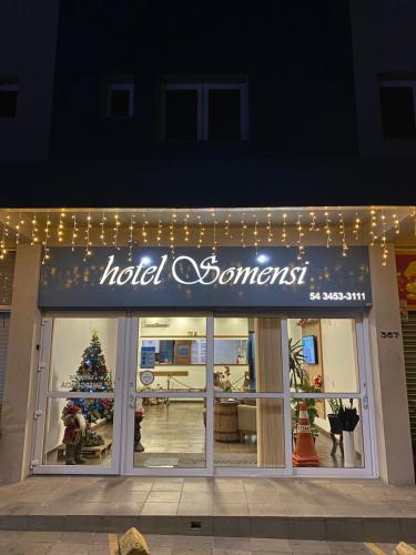a hotel somerset sign on the front of a store at Hotel Somensi in Bento Gonçalves