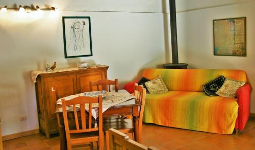a living room with a table and a couch at Vinciucci in Ispica