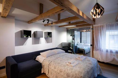 Katil atau katil-katil dalam bilik di Merkela Loft Apartment Beside Vermanes Park