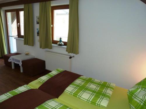 Ένα ή περισσότερα κρεβάτια σε δωμάτιο στο Ferienhaus Blümel inkl. freier Strandbadeintritt