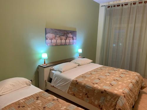 En eller flere senge i et værelse på Hotel Del Lago