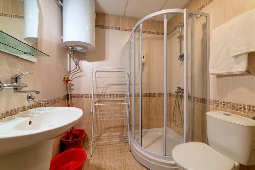 a bathroom with a shower and a toilet and a sink at April Studios in Sandanski in Sandanski