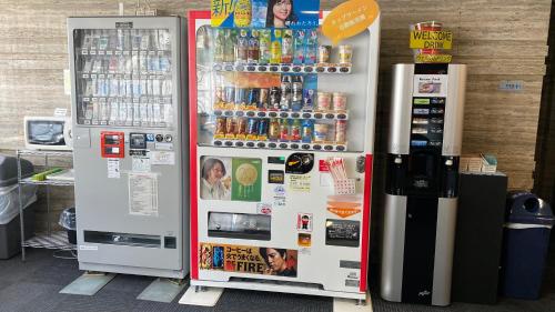 two vending machines in a store with drinks at Osaka Moriguchi Plaza Hotel in Osaka