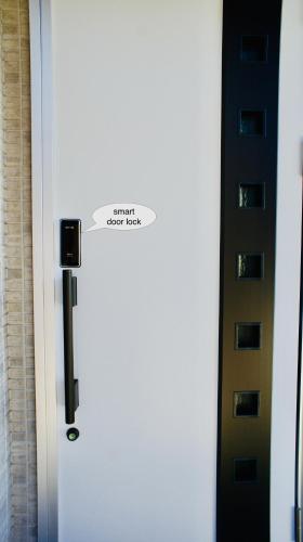 a white refrigerator with a sign on the door at Compass Karuizawa in Karuizawa