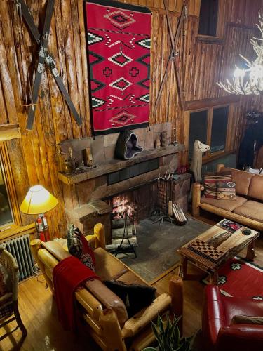 a living room with a couch and a fireplace at Beyul Retreat in Meredith