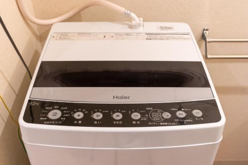 a hello microwave oven sitting in a room at VACATION INN HEIWAJIMA I in Tokyo
