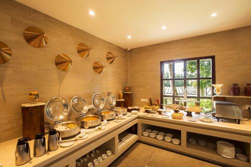 a kitchen with a bunch of pots and pans at Sea Shell Resort & Spa, Havelock in Havelock Island