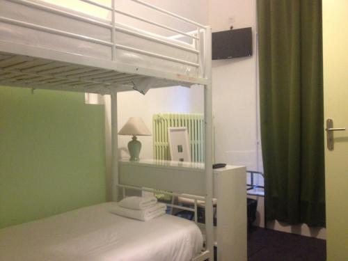 a bedroom with a bunk bed with a ladder at Hotel Couleurs Sud Centre-ville Gare Charleville-Mézières in Charleville-Mézières