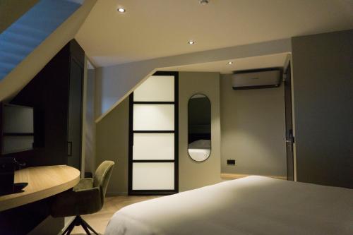 Een bed of bedden in een kamer bij Hotel Central