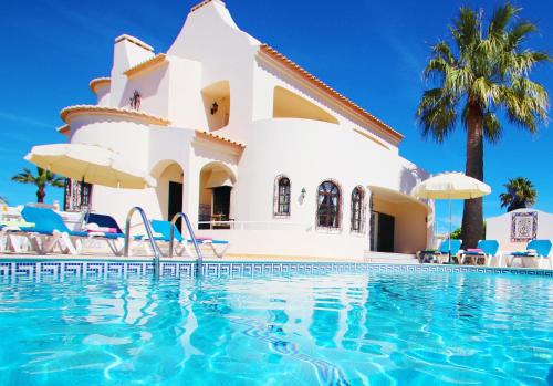 a villa with a pool at a resort at Villa Morais by Algarve Vacation in Guia