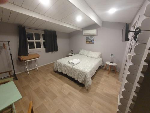 a bedroom with a bed and a wooden floor at Trangie Caravan Park in Trangie