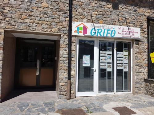 a stone building with a entrance to a carrite at NEVADA 1 - PAS DE LA CASA MOUNTAIN in Pas de la Casa