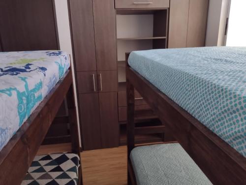 Apartamento Moniquiraにあるベッド