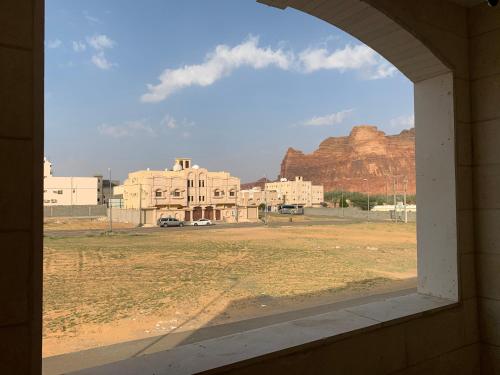 an open window with a view of a mountain at Luxury fully furnished villa ڤيلا مؤثثة in AlUla