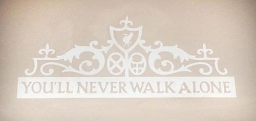 a stencil of a crown with the words youll never walk alone at Little Rock Guest House in Gaeta