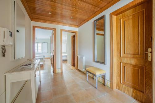 a kitchen with a door and a table and a chair at Rio Gilao in Tavira