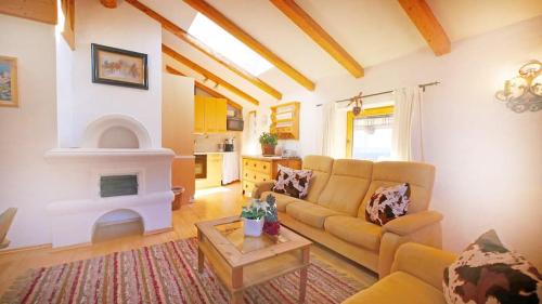 a living room with a couch and a fireplace at Haus Jochbergerstrasse 116 in Kitzbühel