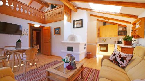 a living room with a couch and a table at Haus Jochbergerstrasse 116 in Kitzbühel