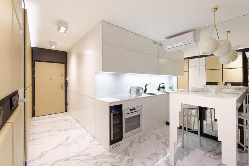 Kuchyň nebo kuchyňský kout v ubytování Super-Apartamenty VIP Jacuzzi