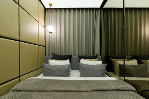 En eller flere senger på et rom på Super-Apartamenty VIP Jacuzzi