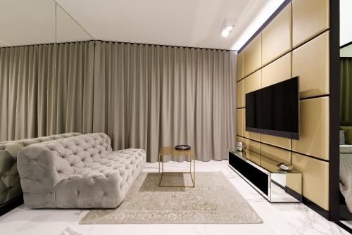 TV a/nebo společenská místnost v ubytování Super-Apartamenty VIP Jacuzzi