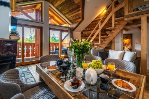 a dining room with a table with food on it at Aparthotel Giewont in Zakopane