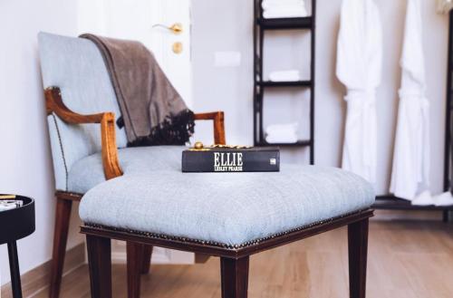 a blue chair with a box on top of it at Downtown Loulé in Loulé