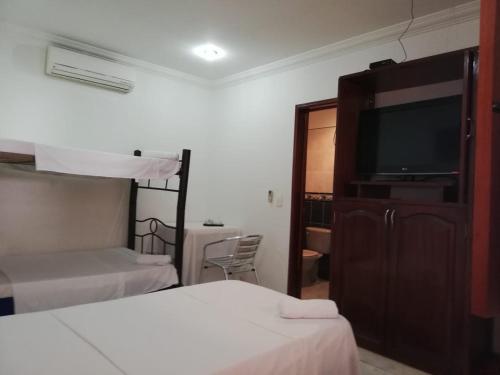 Кровать или кровати в номере Gran Hotel Valvanera Girardot
