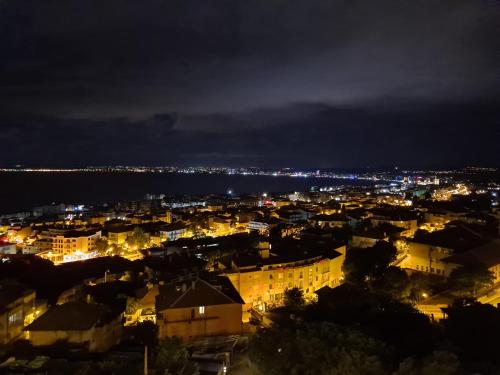 a view of a city at night at Sea View Hills in Sveti Vlas