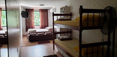 Postel nebo postele na pokoji v ubytování Paz e Amor Suite