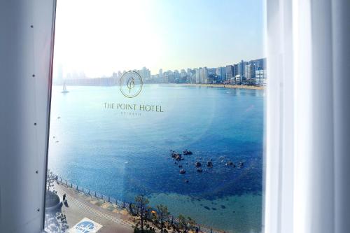 a view from a window of a view of a body of water at Ocean The Point Hotel Busan in Busan