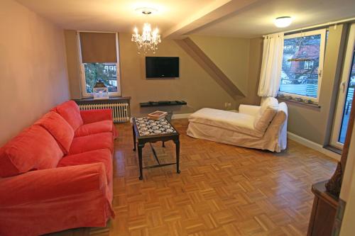 a living room with a couch and a table at Unser Märchenhaus in Braunlage