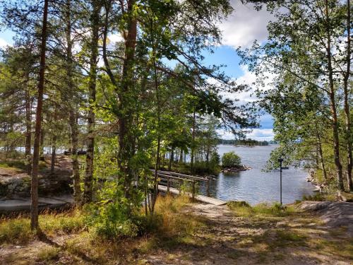 a view of a lake through the trees at Stuga Glaskogen in Glava