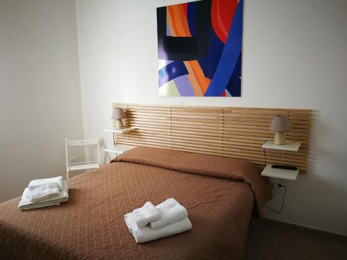 A bed or beds in a room at Stella del Sud Guesthouse