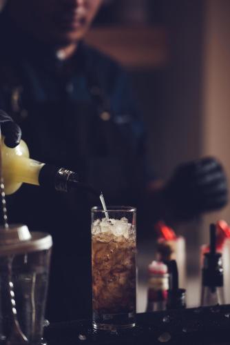 a drink with a straw is sitting on a table at Matala Bay Hotel in Matala