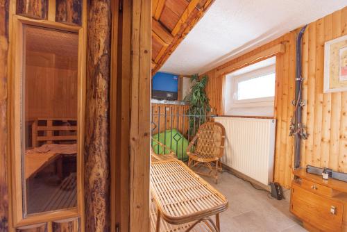 a small room with a table and a chair at APARTMENTS ROGLA JURGOVO - Ski in Ski out in Lukanja