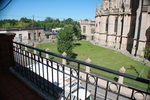 a view of a building from a balcony at Hotel Catedral in Luján