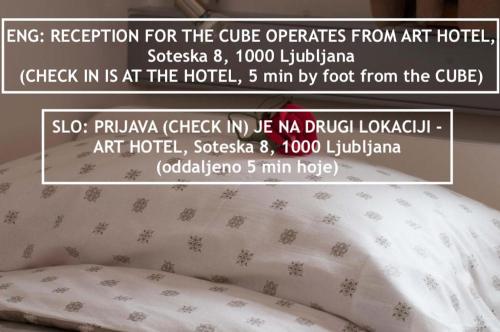 a poster of a pillow on top of a bed at CUBE central rooms for 2 in Ljubljana