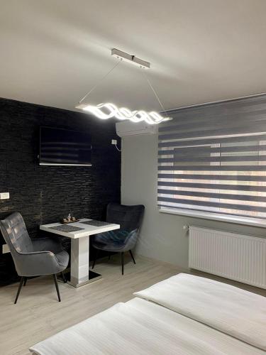 Ένα ή περισσότερα κρεβάτια σε δωμάτιο στο Apartament Catalin 1