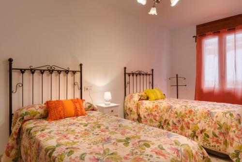 Postel nebo postele na pokoji v ubytování APARTAMENTO CASA PALOMA