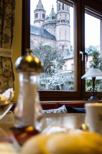 a window with a view of a castle at Hotel Kriemhilde in Worms